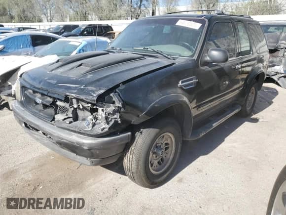 1998 Ford Explorer with VIN 1FMYU22E0WUD43223, listed as a Copart auction lot 64430825 with 180,159 mi miles and Salvage title. Bid and sale history available at DreamBid. Image 1.