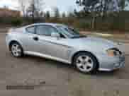 2003 Hyundai Tiburon GT с VIN KMHHN65F13U013420, выставлен на аукционе Copart как лот 51234495 с пробегом 230 612 миль миль и Списание • Salvage title. История ставок и продаж доступна на DreamBid. Изображение 4.