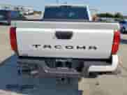 2025 Toyota Tacoma SR5 with VIN 3TMKB5FNXSM036779, listed as a Copart auction lot 68123025 with 557 mi miles and Salvage title. Bid and sale history available at DreamBid. Image 6.