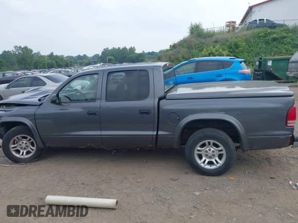 2003 Dodge Dakota Sport with VIN 1D7HL38X13S234210, listed as a IAAI auction lot 42913327 with 173,497 mi miles and . Bid and sale history available at DreamBid. Image 14.