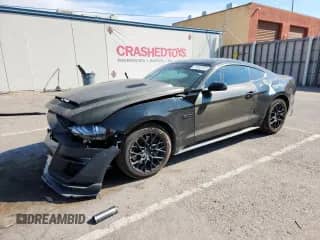 2021 Ford Mustang GT с VIN 1FA6P8CFXM5155562, выставлен на аукционе Copart как лот 71040295 с пробегом Не указан миль и Списание • Salvage title. История ставок и продаж доступна на DreamBid. Изображение 1.