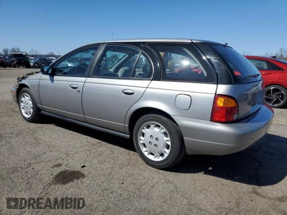1997 Saturn SW with VIN 1G8ZK8274VZ194085, listed as a Copart auction lot 50230135 with 211,051 mi miles and Salvage title. Bid and sale history available at DreamBid. Image 2.