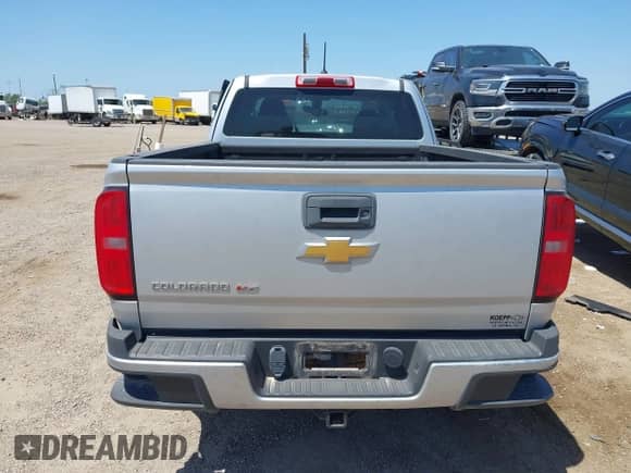 2018 Chevrolet Colorado 4WD Work Truck z VIN 1GCHTBEN5J1265177, wystawiony jako IAAI lot #42017849 z przebiegiem Nie podano mil oraz . Historia ofert i sprzedaży dostępna na DreamBid. Obrazek 17.