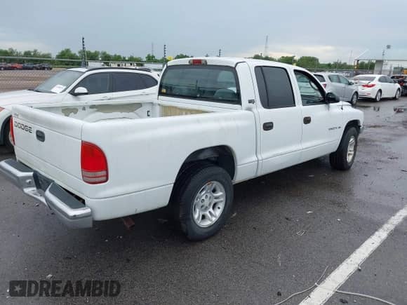 2001 Dodge Dakota Sport with VIN 1B7GL2AN81S102874, listed as a IAAI auction lot 43001313 with 158,635 mi miles and . Bid and sale history available at DreamBid. Image 4.
