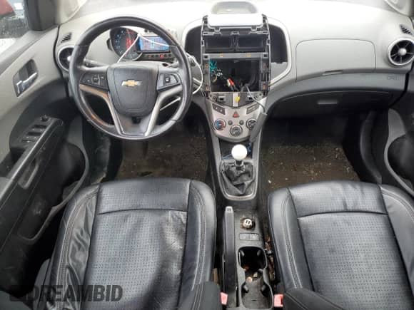 2012 Chevrolet Sonic LTZ с VIN 1G1JF6SH7C4151724, выставлен на аукционе Copart как лот 82821394 с пробегом 148 895 миль миль и Списание • Salvage title. История ставок и продаж доступна на DreamBid. Изображение 8.