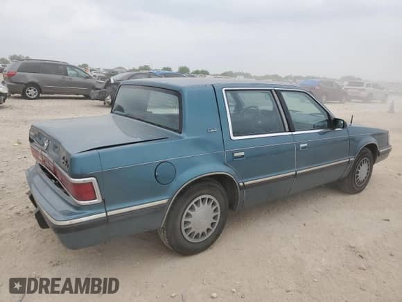 1993 Dodge Dynasty LE with VIN 1B3XC56R3PD124521, listed as a Copart auction lot 51825725 with 94,336 mi miles and Salvage title. Bid and sale history available at DreamBid. Image 3.