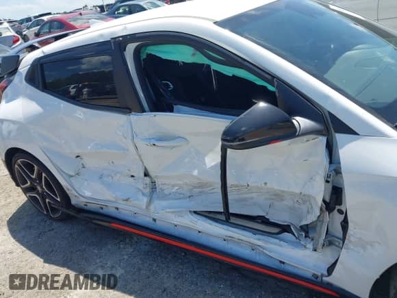 2022 Hyundai Veloster z VIN KMHT36AH3NU014434, wystawiony jako IAAI lot #42540378 z przebiegiem 28 106 mil mil oraz . Historia ofert i sprzedaży dostępna na DreamBid. Obrazek 6.