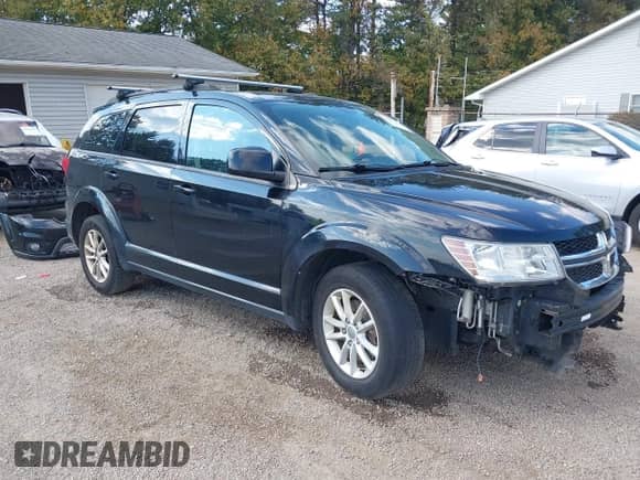 2014 Dodge Journey SXT with VIN 3C4PDCBG0ET141000, listed as a IAAI auction lot 43255379 with 199,750 mi miles and . Bid and sale history available at DreamBid. Image 1.