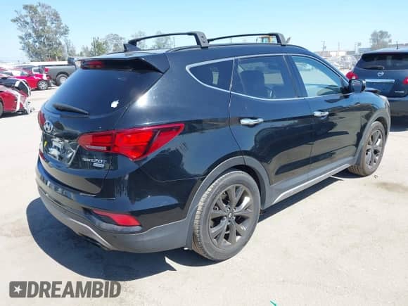 2018 Hyundai Santa Fe Ultimate z VIN 5XYZW4LAXJG551792, wystawiony jako IAAI lot #42414750 z przebiegiem 144 327 mil mil oraz . Historia ofert i sprzedaży dostępna na DreamBid. Obrazek 4.
