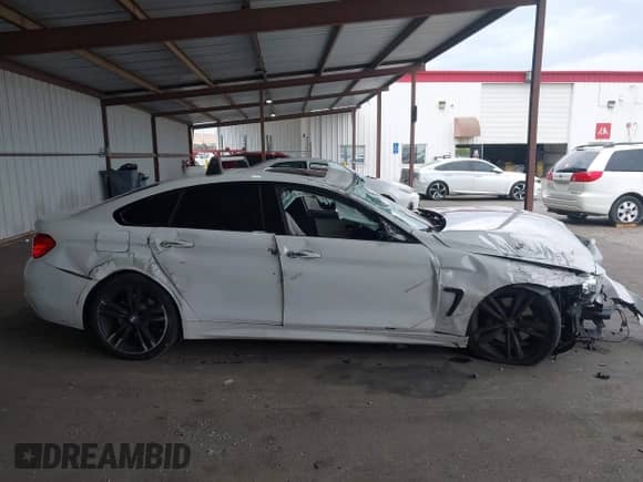 2015 BMW 4 Series 435i with VIN WBA4B1C53FD955009, listed as a IAAI auction lot 43303021 with 130,707 mi miles and . Bid and sale history available at DreamBid. Image 14.