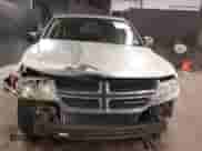 2013 Dodge Journey SE z VIN 3C4PDCAB7DT646083, wystawiony jako IAAI lot #42353530 z przebiegiem 117 965 mil mil oraz . Historia ofert i sprzedaży dostępna na DreamBid. Obrazek 6.