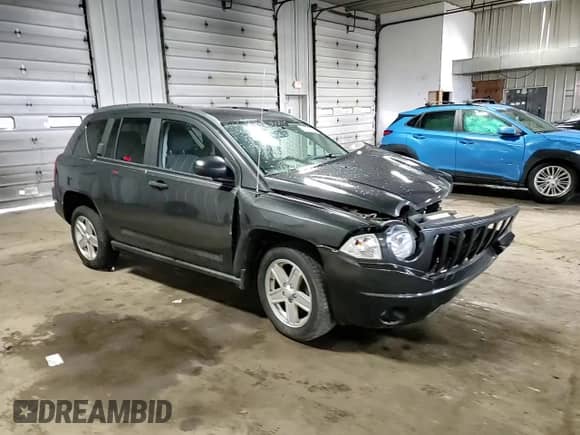 2010 Jeep Compass Sport z VIN 1J4NT1FB3AD647153, wystawiony jako Copart lot #61261595 z przebiegiem Nie podano mil oraz Nie do naprawy • Non repairable. Historia ofert i sprzedaży dostępna na DreamBid. Obrazek 15.