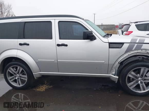 2011 Dodge Nitro Detonator with VIN 1D4PT6GX0BW500626, listed as a IAAI auction lot 41156574 with 152,833 mi miles and . Bid and sale history available at DreamBid. Image 13.