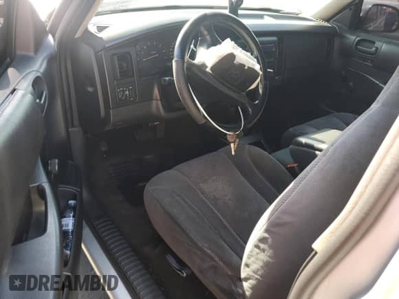 2002 Dodge Dakota z VIN 1B7FL16X72S632397, wystawiony jako Copart lot #87450164 z przebiegiem Nie podano mil oraz Szkoda całkowita • Salvage title. Historia ofert i sprzedaży dostępna na DreamBid. Obrazek 8.