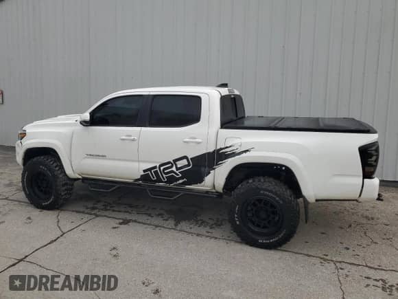 2021 Toyota Tacoma SR with VIN 3TMCZ5AN6MM426322, listed as a Copart auction lot 67056905 with 71,144 mi miles and Clean title. Bid and sale history available at DreamBid. Image 2.