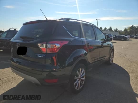 2017 Ford Escape Titanium с VIN 1FMCU9JD7HUB88314, выставлен на аукционе Copart как лот 90627415 с пробегом 165 953 миль миль и Чистый • Clean title. История ставок и продаж доступна на DreamBid. Изображение 4.