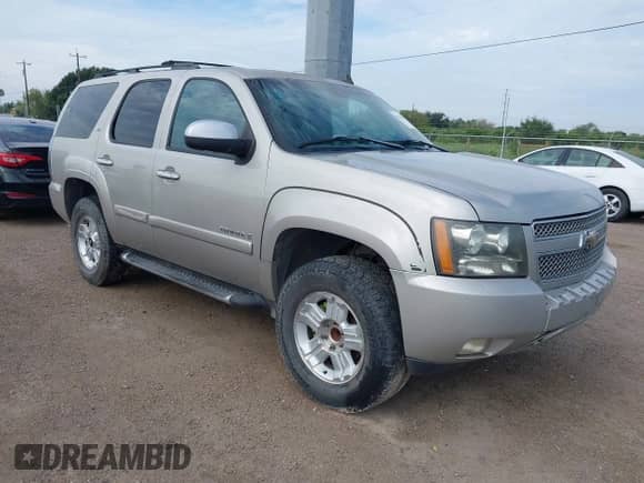 2007 Chevrolet Tahoe LTZ with VIN 1GNFK13027R341063, listed as a IAAI auction lot 43143783 with 273,637 mi miles and . Bid and sale history available at DreamBid. Image 1.