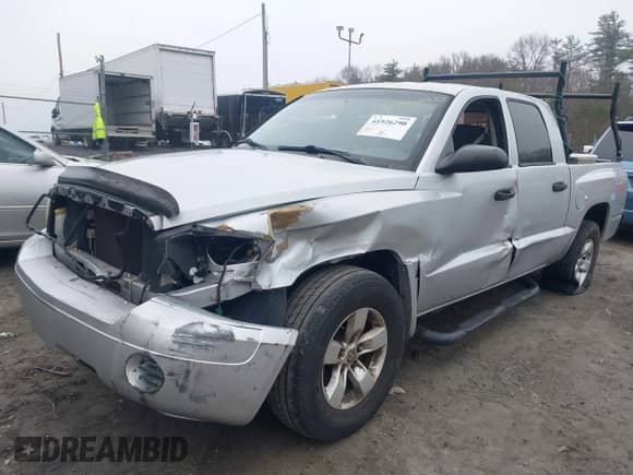2006 Dodge Dakota ST with VIN 1D7HE28K76S702504, listed as a IAAI auction lot 41926290 with 195,151 mi miles and . Bid and sale history available at DreamBid. Image 2.