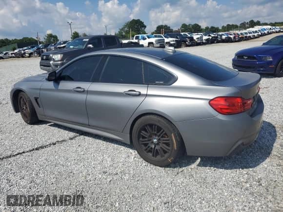 2015 BMW 4 Series 435i with VIN WBA4B1C51FG241443, listed as a Copart auction lot 61026285 with 149,384 mi miles and Salvage title. Bid and sale history available at DreamBid. Image 2.