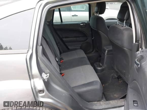 2011 Dodge Caliber Mainstreet with VIN 1B3CB3HA6BD254282, listed as a IAAI auction lot 43203478 with 73,592 mi miles and . Bid and sale history available at DreamBid. Image 8.
