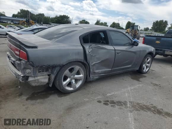 2012 Dodge Charger SXT z VIN 2C3CDXHG6CH126234, wystawiony jako Copart lot #70297715 z przebiegiem 142 644 mil mil oraz Szkoda całkowita • Salvage title. Historia ofert i sprzedaży dostępna na DreamBid. Obrazek 3.