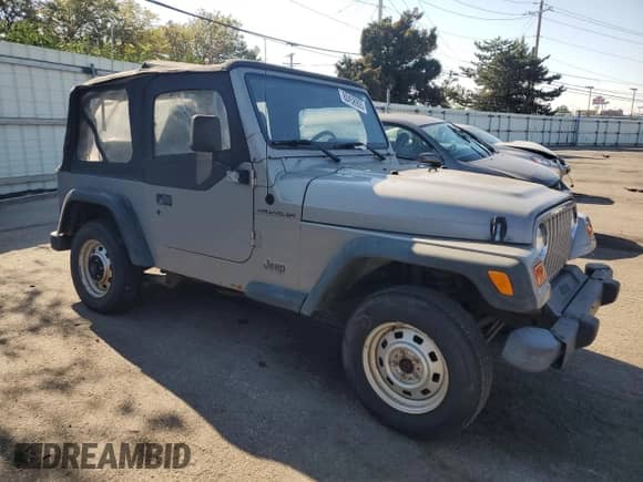 2000 Jeep Wrangler SE with VIN 1J4FA29P4YP775935, listed as a Copart auction lot 80458955 with 100,211 mi miles and Salvage title. Bid and sale history available at DreamBid. Image 4.