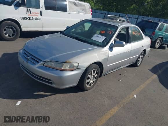 2002 Honda Accord SE z VIN 1HGCG668X2A059712, wystawiony jako IAAI lot #42904135 z przebiegiem Nie podano mil oraz . Historia ofert i sprzedaży dostępna na DreamBid. Obrazek 2.