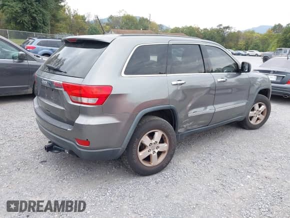 2012 Jeep Grand Cherokee Laredo with VIN 1C4RJFAG3CC272631, listed as a IAAI auction lot 43291923 with 168,220 mi miles and . Bid and sale history available at DreamBid. Image 4.