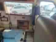 1999 Ford Econoline Cargo Recreational with VIN 1FDRE14LXXHB69162, listed as a Copart auction lot 82242285 with 92,834 mi miles and Salvage title. Bid and sale history available at DreamBid. Image 11.