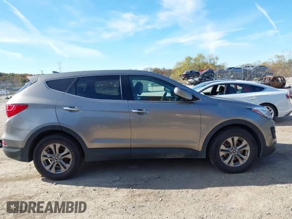 2015 Hyundai Santa Fe z VIN 5XYZTDLB1FG299066, wystawiony jako IAAI lot #43541540 z przebiegiem 78 175 mil mil oraz . Historia ofert i sprzedaży dostępna na DreamBid. Obrazek 13.