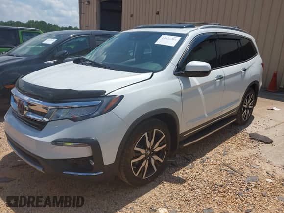 2022 Honda Pilot Touring 8-Passenger with VIN 5FNYF5H96NB004676, listed as a IAAI auction lot 42636581 with 23,428 mi miles and . Bid and sale history available at DreamBid. Image 2.