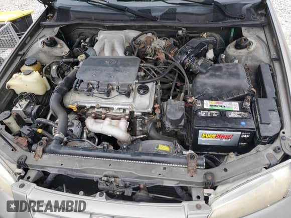 1997 Toyota Camry LE z VIN 4T1BF22K2VU003320, wystawiony jako Copart lot #86212035 z przebiegiem 308 405 mil mil oraz Szkoda całkowita • Salvage title. Historia ofert i sprzedaży dostępna na DreamBid. Obrazek 11.