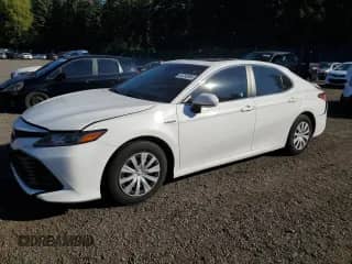 2020 Toyota Camry Hybrid LE with VIN 4T1E31AK6LU014142, listed as a Copart auction lot 82250985 with 90,637 mi miles and Salvage title. Bid and sale history available at DreamBid. Image 1.