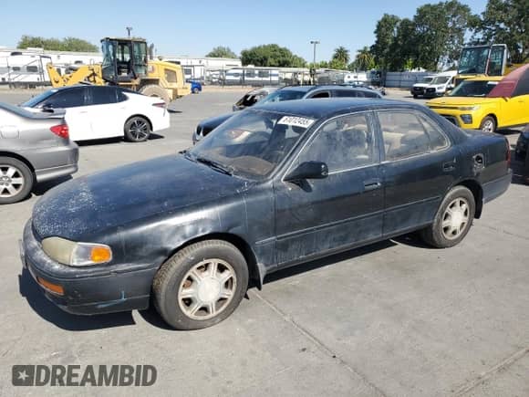 1995 Toyota Camry LE z VIN 4T1GK12E9SU084799, wystawiony jako Copart lot #61012455 z przebiegiem 179 743 mil mil oraz Czysty tytuł • Clean title. Historia ofert i sprzedaży dostępna na DreamBid. Obrazek 1.