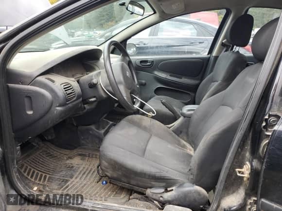 2003 Dodge Neon SE with VIN 1B3ES26C63D229990, listed as a Copart auction lot 75457134 with 178,329 mi miles and Salvage title. Bid and sale history available at DreamBid. Image 7.