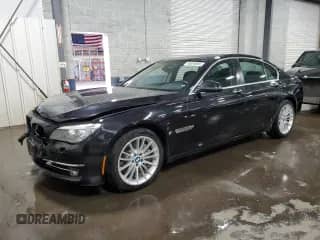2013 BMW 7 Series 750i xDrive with VIN WBAYB6C59DD223852, listed as a Copart auction lot 49304695 with 124,989 mi miles and Salvage title. Bid and sale history available at DreamBid. Image 1.