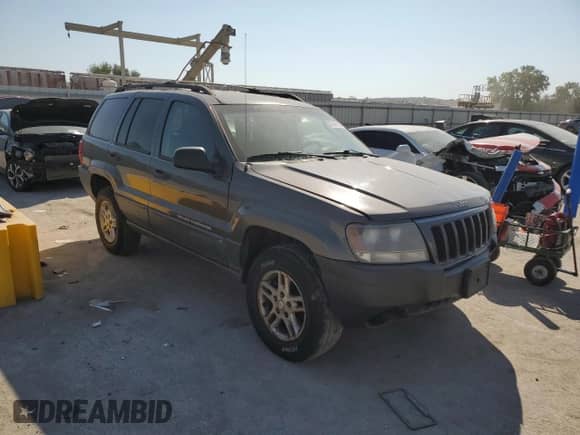 2004 Jeep Grand Cherokee Laredo with VIN 1J4GW48S84C348685, listed as a Copart auction lot 85169715 with 204,660 mi miles and Salvage title. Bid and sale history available at DreamBid. Image 4.