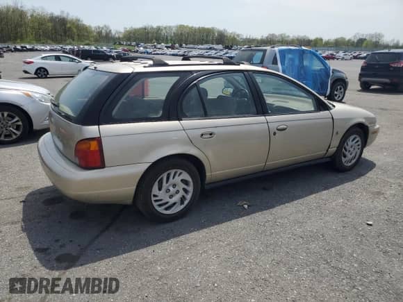 1999 Saturn SW with VIN 1G8ZJ827XXZ323713, listed as a Copart auction lot 55183385 with 166,834 mi miles and Salvage title. Bid and sale history available at DreamBid. Image 3.