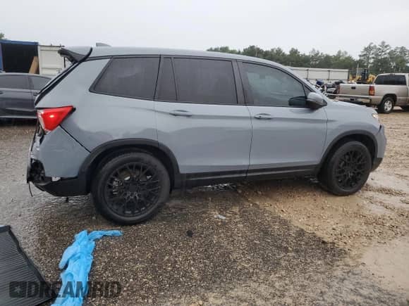 2023 Honda Passport EX-L with VIN 5FNYF8H57PB010844, listed as a Copart auction lot 65769665 with 41,842 mi miles and Salvage title. Bid and sale history available at DreamBid. Image 3.