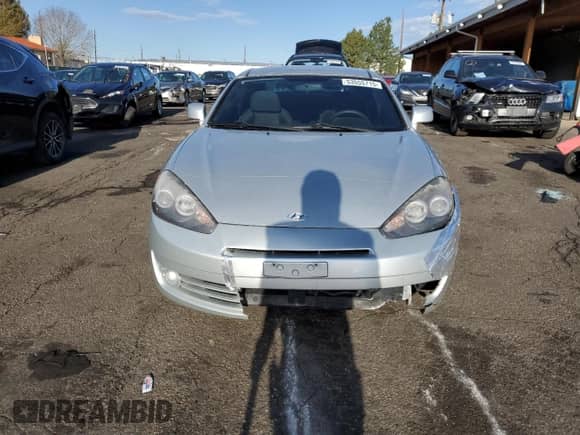 2007 Hyundai Tiburon GS with VIN KMHHM66DX7U246220, listed as a Copart auction lot 53555715 with 105,305 mi miles and Salvage title. Bid and sale history available at DreamBid. Image 5.