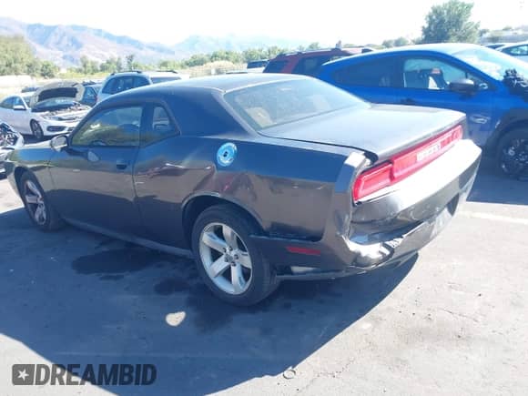 2013 Dodge Challenger SXT with VIN 2C3CDYAGXDH675016, listed as a IAAI auction lot 43325216 with 129,120 mi miles and . Bid and sale history available at DreamBid. Image 3.