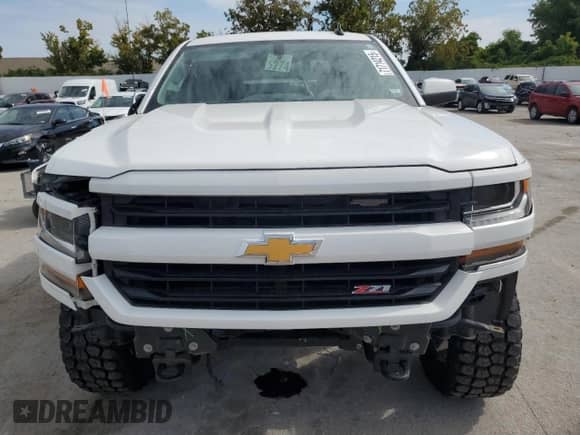 2018 Chevrolet Silverado 1500 LT z VIN 3GCUKREC7JG484152, wystawiony jako Copart lot #71714215 z przebiegiem 158 596 mil mil oraz Szkoda całkowita • Salvage title. Historia ofert i sprzedaży dostępna na DreamBid. Obrazek 5.