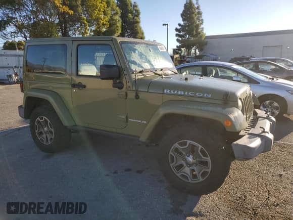 2013 Jeep Wrangler Rubicon with VIN 1C4HJWCG8DL535223, listed as a Copart auction lot 86492615 with 124,963 mi miles and Salvage title. Bid and sale history available at DreamBid. Image 4.