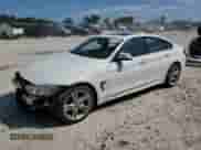 2016 BMW 4 Series 428i xDrive with VIN WBA4C9C51GG135622, listed as a Copart auction lot 68421505 with 143,971 mi miles and Salvage title. Bid and sale history available at DreamBid. Image 1.