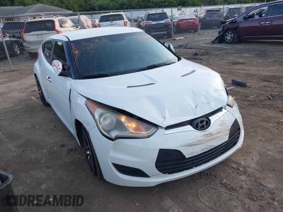 2014 Hyundai Veloster z VIN KMHTC6AD0EU204382, wystawiony jako IAAI lot #40287015 z przebiegiem 110 460 mil mil oraz . Historia ofert i sprzedaży dostępna na DreamBid. Obrazek 1.