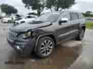 2017 Jeep Grand Cherokee Overland with VIN 1C4RJECG5HC605538, listed as a Copart auction lot 81946415 with 100,658 mi miles and Salvage title. Bid and sale history available at DreamBid. Image 1.