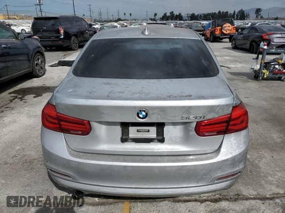 2018 BMW 3 Series 320i with VIN WBA8A9C50JAH13343, listed as a Copart auction lot 70562555 with 110,990 mi miles and Salvage title. Bid and sale history available at DreamBid. Image 6.