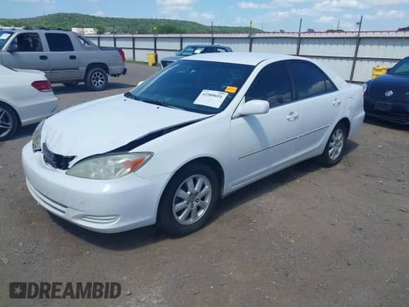 2002 Toyota Camry LE z VIN 4T1BE32K52U054301, wystawiony jako IAAI lot #42509651 z przebiegiem 290 481 mil mil oraz . Historia ofert i sprzedaży dostępna na DreamBid. Obrazek 17.
