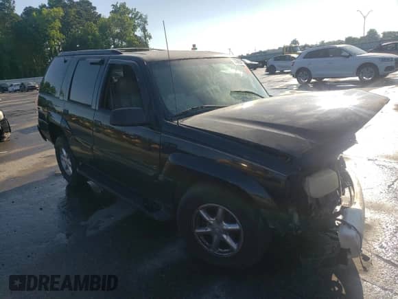 2000 Cadillac Escalade with VIN 1GYEK13R9YR107792, listed as a Copart auction lot 57686585 with 282,947 mi miles and Salvage title. Bid and sale history available at DreamBid. Image 4.