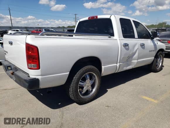 2003 Dodge 1500 ST with VIN 1D7HA18K03J582326, listed as a Copart auction lot 53682044 with 148,564 mi miles and Salvage title. Bid and sale history available at DreamBid. Image 3.